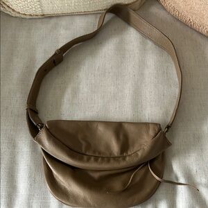 HOBO Tan Crossbody Bag with Adjustable Strap and Crescent Shape